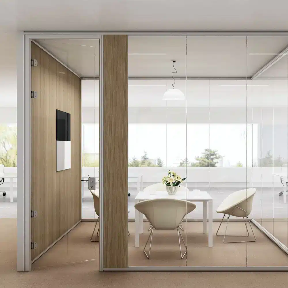 Glass wall office with swing door and frameless construction.
